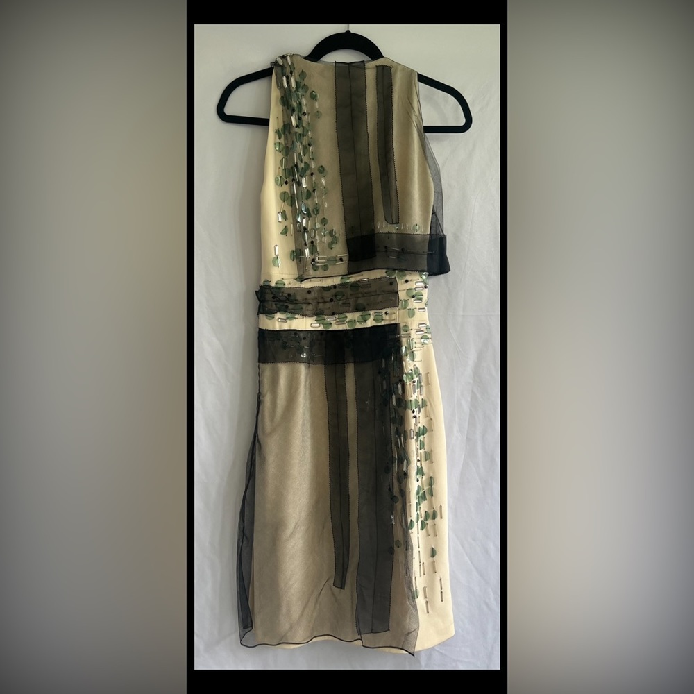 Carolina Herrera cream dress with black tulle and beading. Size 2-4.